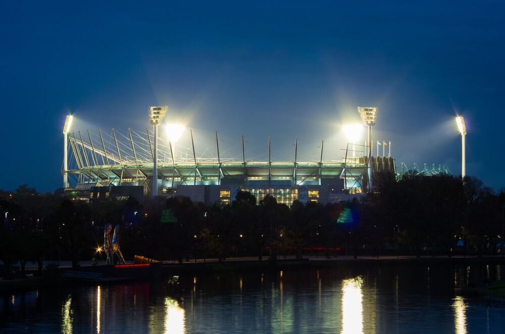 Melbourne Private Tours MCG loodlit for a twilight match of Australian Rules Football