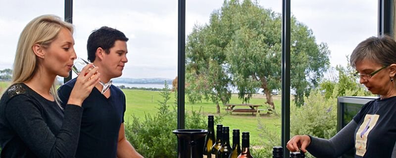 Couple tasting wine at Purple Hen Winery
